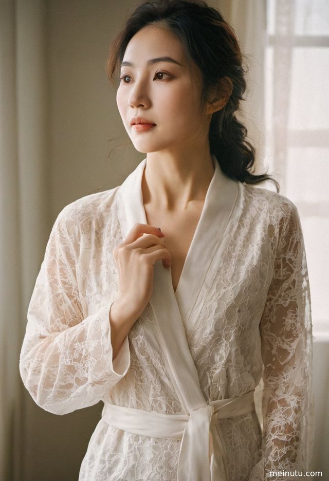 Adult asian woman's face illuminated by soft, moving backlight by the sea.